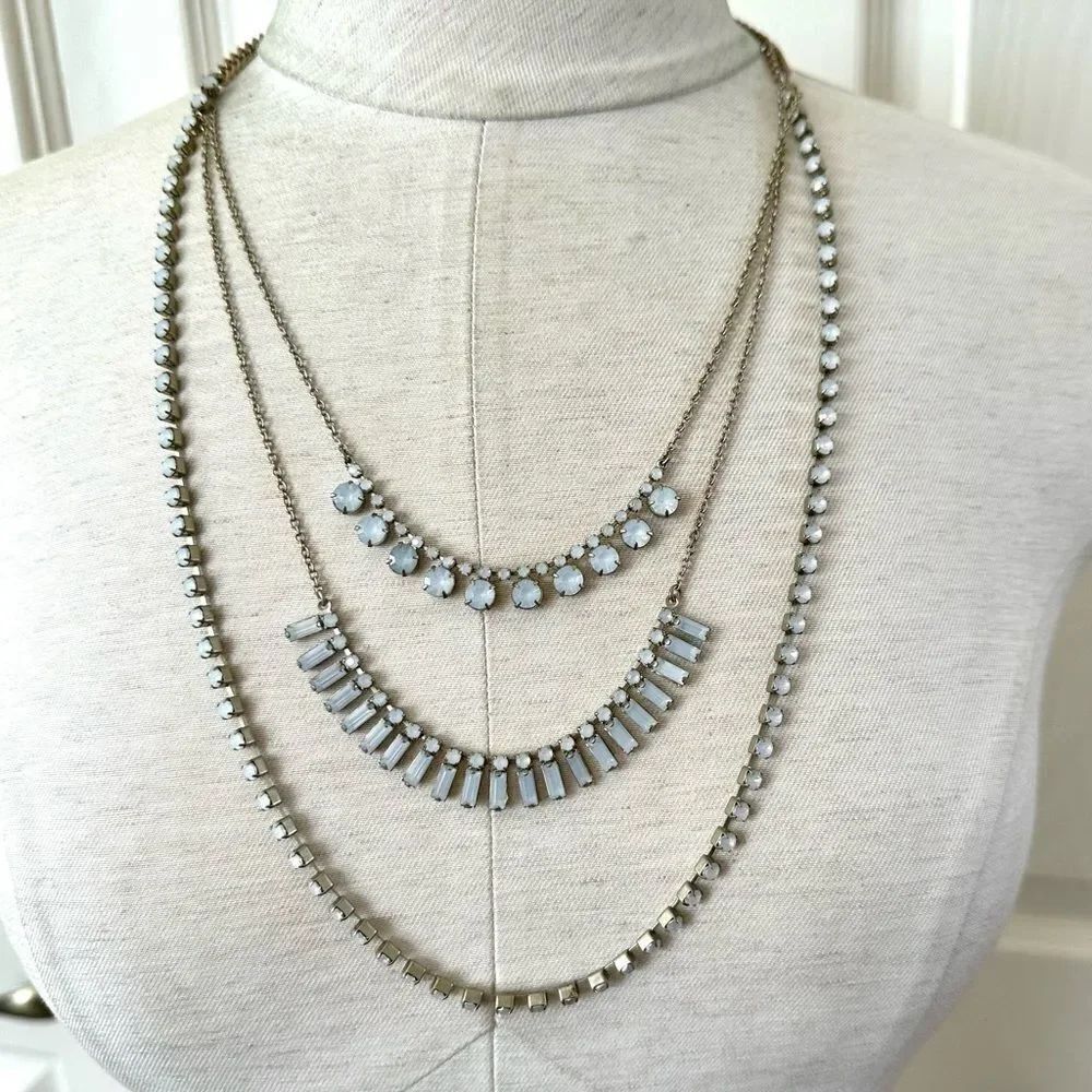 Multi tier gold tone light blue beaded necklace